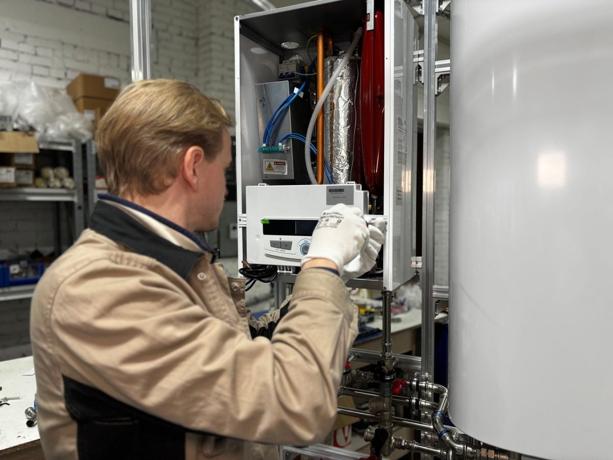 Heating engineer servicing a domestic boiler
