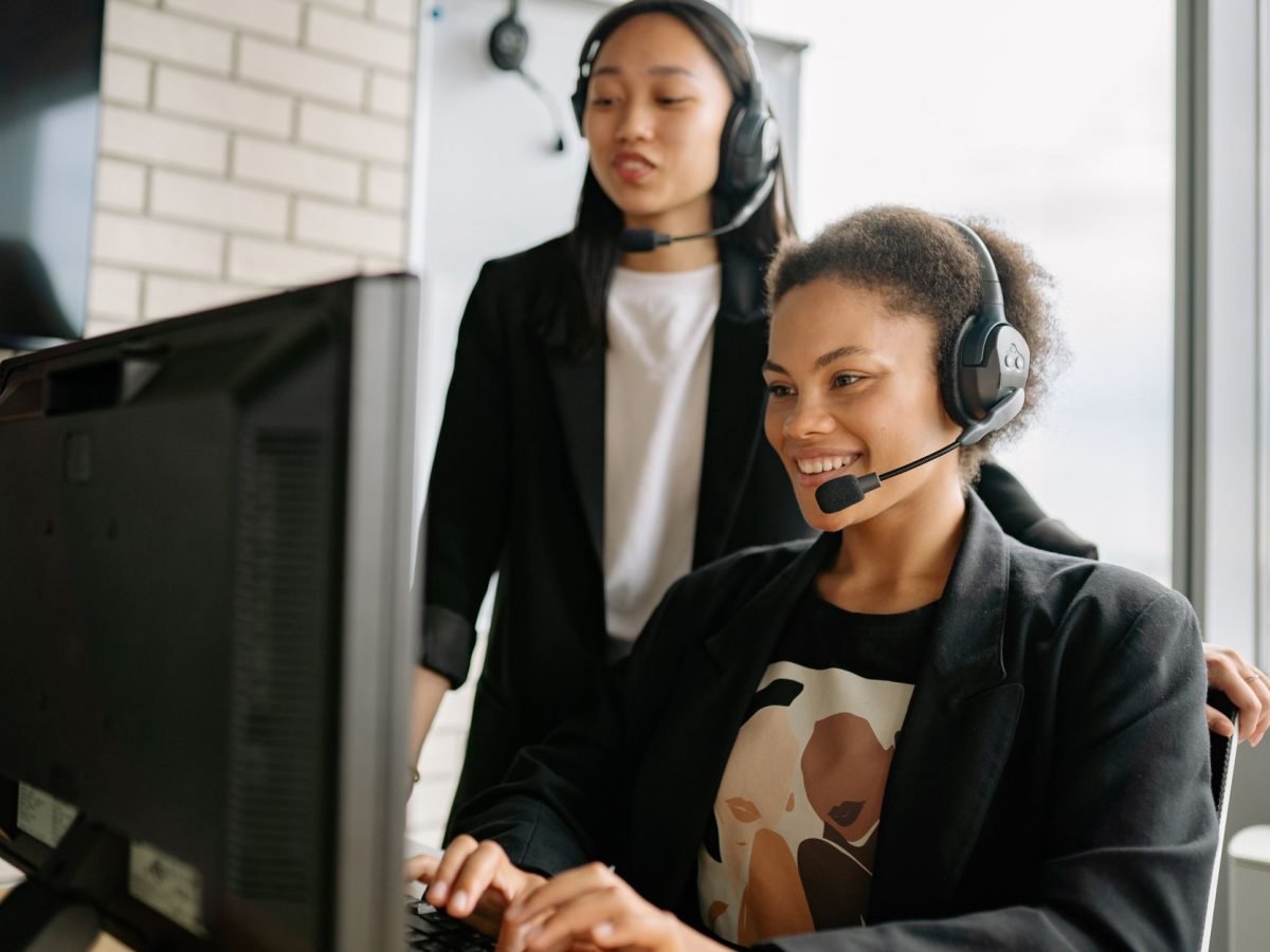 Customer service agents with headsets taking bookings by phone