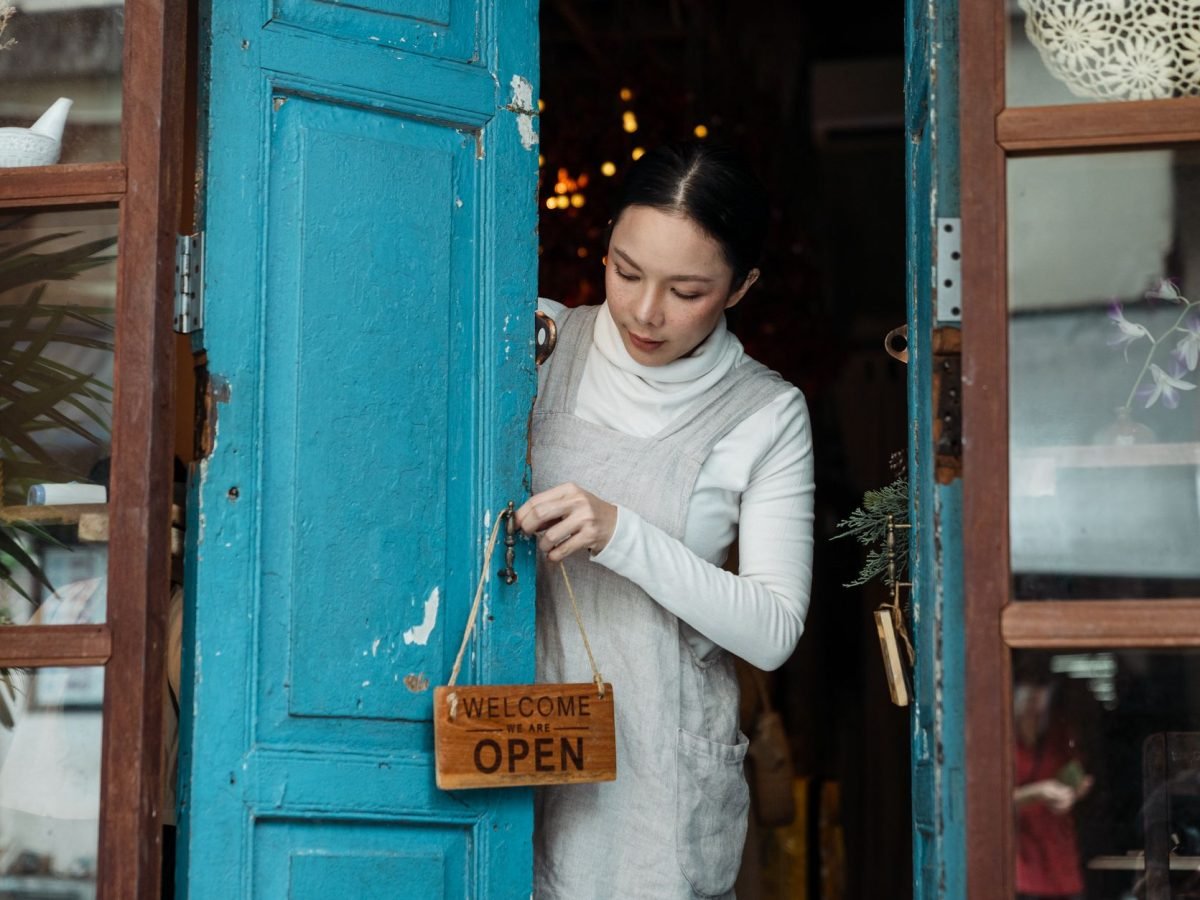 New business owner reviewing paperwork behind the counter